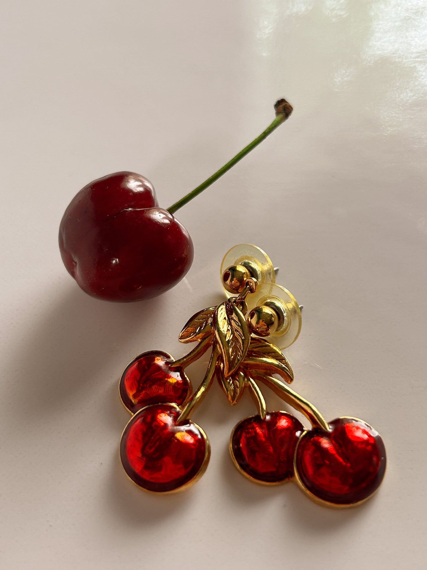 Vintage Avon cherry pierced earrings gold and red.
