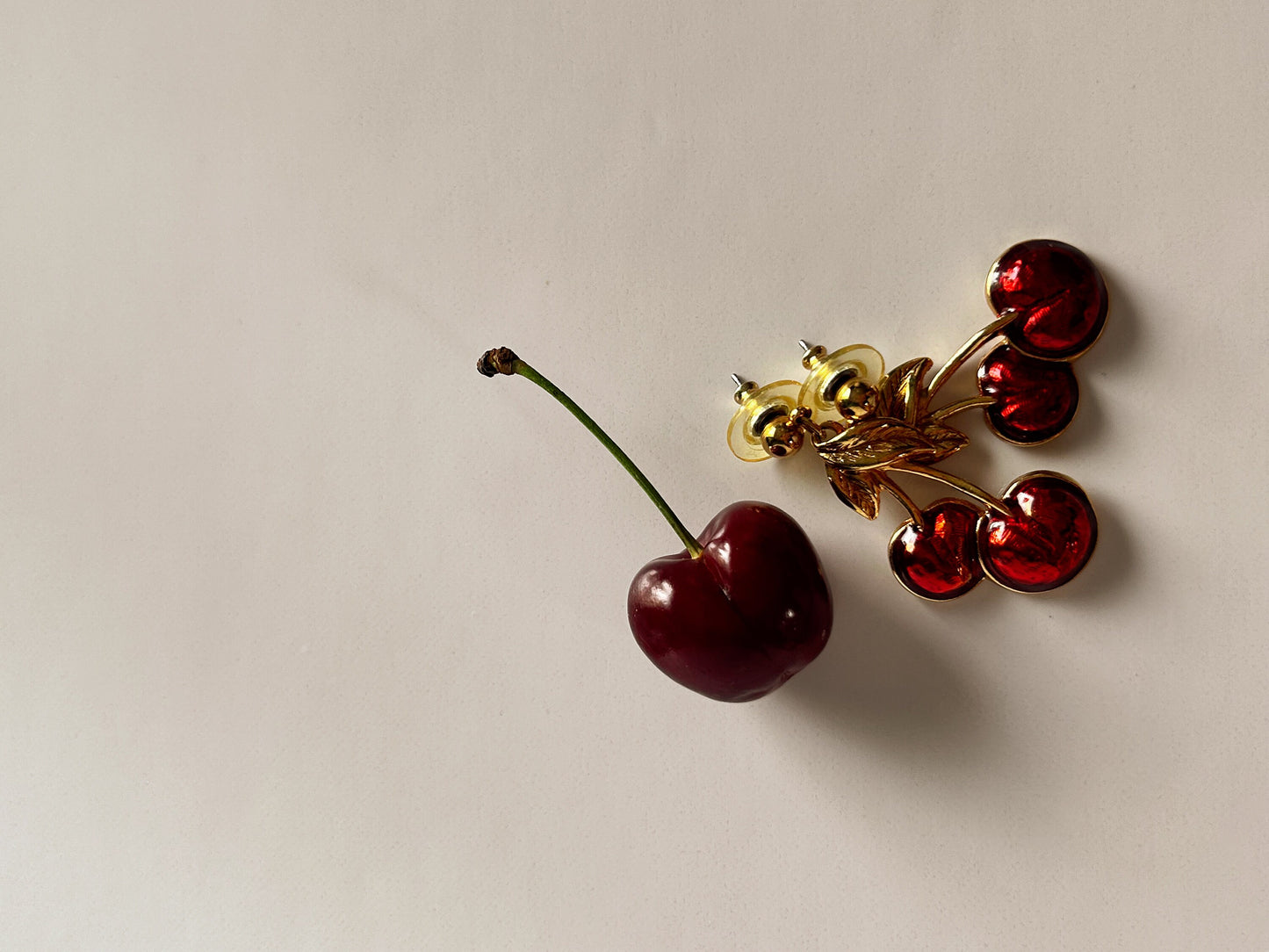 Vintage Avon cherry pierced earrings gold and red.