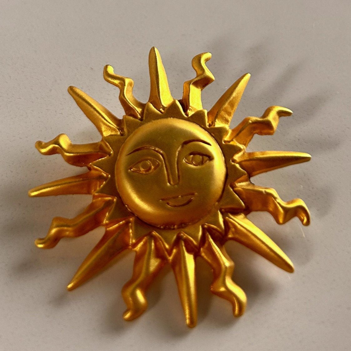 Vintage Art Nouveau golden sun brooch