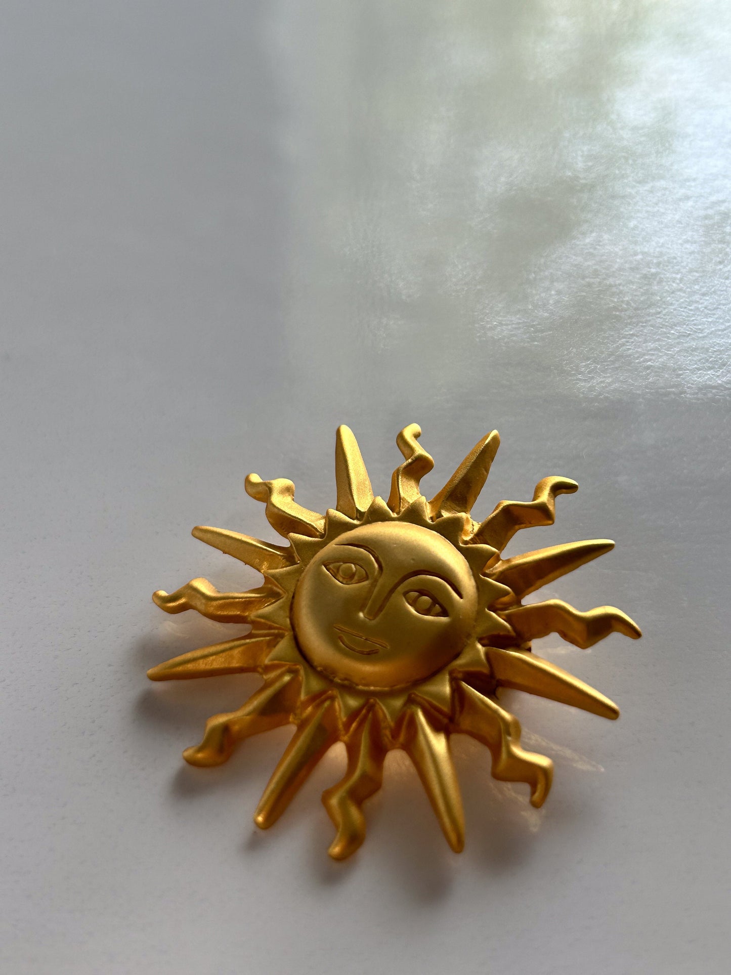 Vintage Art Nouveau golden sun brooch