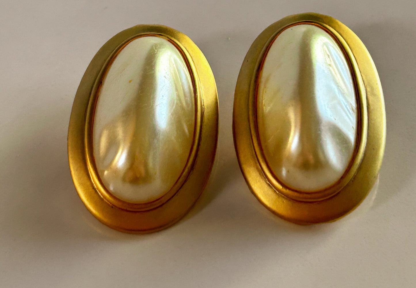 Vintage gold and white oval clip on earrings